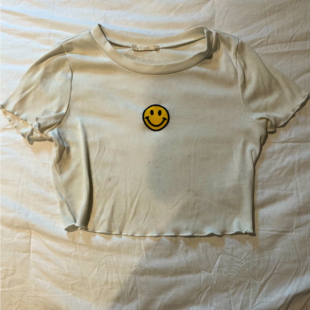 White ripped crop top with yellow smiley face